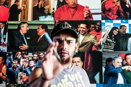 Caracas, Venezuela - 20 june 2018: supporter of chavista government angry and trying to stop press photographer. The socialist governement has a total control of press in the crisis hit country.のeditorial素材