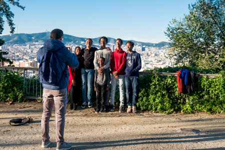 Barcelona, Spain - 24 november 2018: group of young smiling african american friends and family pose...