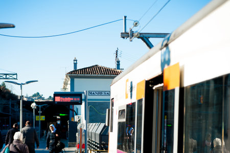 Manresa, Spain - 03 january 2019: regional spanish train arriving in small railway station of small...