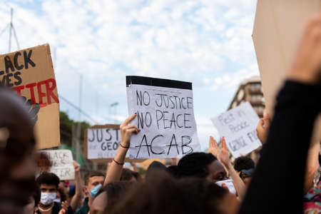 Barcelona, spain - 1 june 2020: Black lives matter movement march in demanding end of police brutality and racism against african-americans and people of color after the killing of George Floyd, chanting and holding bannersのeditorial素材