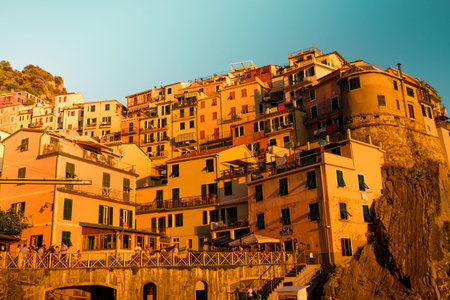 romantic panoramic view of Manarola village in Cinque Terre national park in Italy, in the middle of...