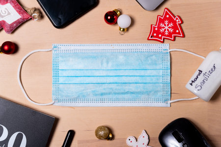coronavirus christmas holidays office concept. Medical face mask, 2020 covid19 era Christmas holiday...