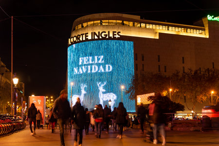 barcelona, spain - 21 december 2020: christmas shopping time in barcelona passeig de gracia street. crowd at night doing christmas shopping with christmas lights before curfewのeditorial素材