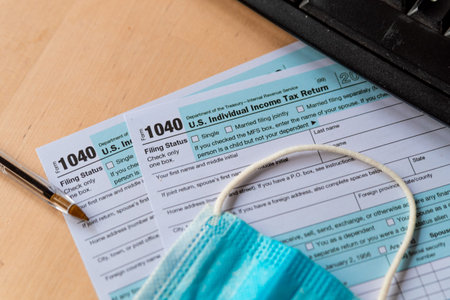 washington, usa - 3 march 2021: close up of form 1040 american income tax declaration form, symbol...