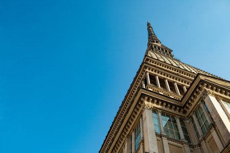 Mole Antonelliana landmark monument of Turin city close up view from below with copy space and clear...