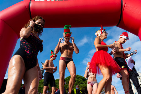 People dressed as Santa Claus at the Christmas traditional Copa Nadal, Spain's oldest open water...
