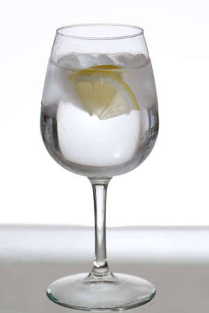 Ice water in a wine glassの写真素材