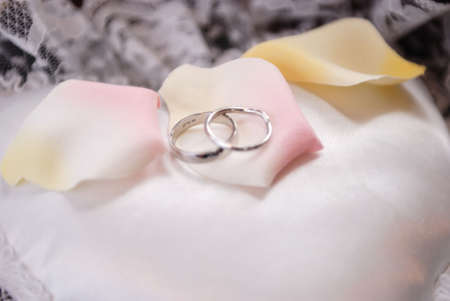 a set of  rings on a soft pillowの写真素材