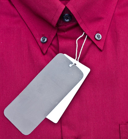 closed up of the red shirt with black & white tag