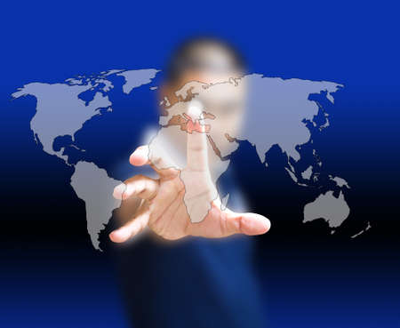 Asian businessman pushing world map on the touchscreenの写真素材
