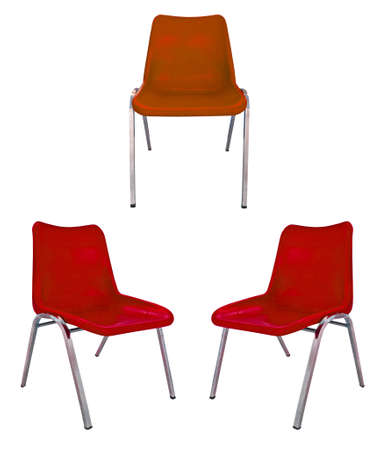 three red plastic chairs on white backgroundの写真素材