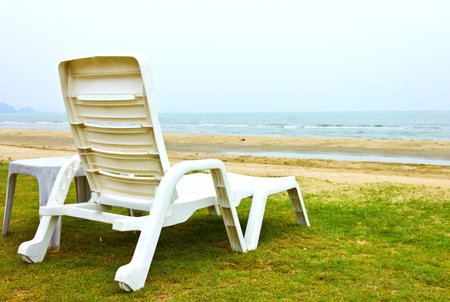 white plastic chair on the beach, Thailand