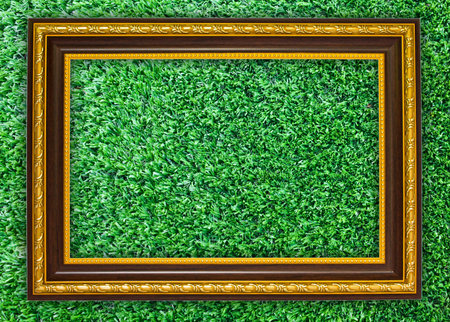 wooden frame on the artificial turf for backgroundの写真素材