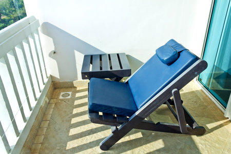 deck chair cushion is in front of the balcony