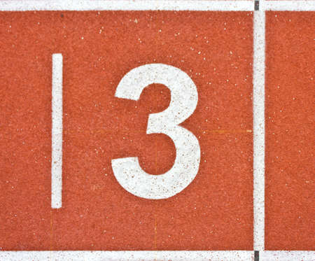 closed up shot of number three on running track linesの写真素材