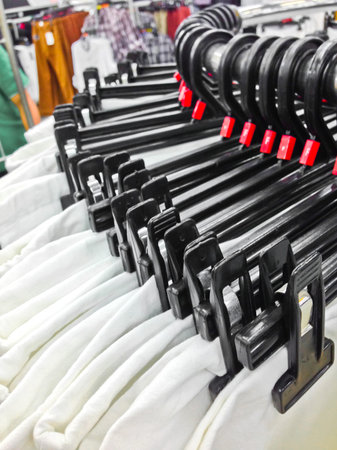 closeup of some clothes hanging on a rail