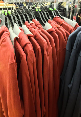 closeup of some clothes hanging on a rail