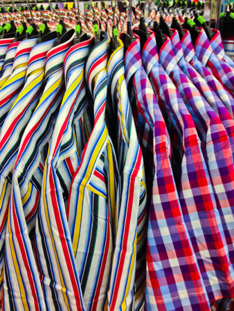 closeup of some clothes hanging on a rail