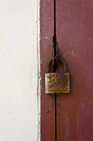 the old locked on wooden doorの写真素材