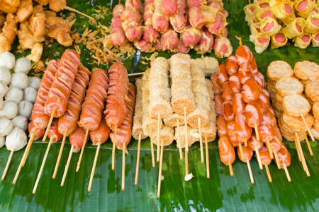 fried sausages and fried meatballs sold in the fresh markets, Thailandの写真素材