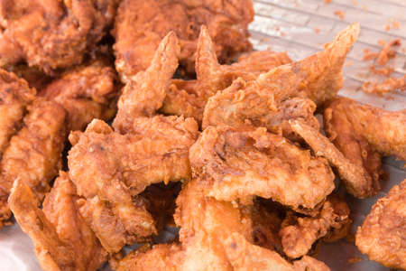 fried chicken wings sold in the fresh market, Thailandの写真素材