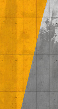 Close-up view of a section of a textured concrete wall, divided diagonally into two sections of bright yellow and gray concrete panel. The surface exhibits a visible pattern of grids, creating a design element. Small spots and imperfections are scattered across the concrete's surface, adding depth to the texture.の素材