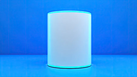 White cylinder with a light turquoise/teal border, standing on a bright blue surface against a matching blue wall. The cylinder is positioned in the foreground, making it the central element of the image.の素材