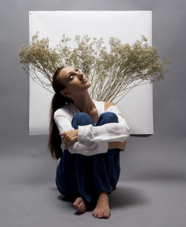 woman sitting on the studio floor