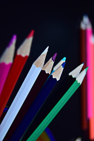 colored pencils close-up on black backgroundの写真素材