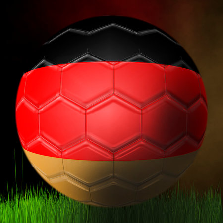 Soccer ball of the German team, on a black background above the grassの写真素材