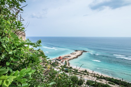 Tropical island landscape, ocean on a bacakground. Beautiful view from the cliff to the coast. Outdoor scenery, Bali island, Indonesia.の写真素材