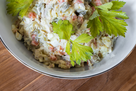 Traditional Russian Christmas and New year salad "Olivier". Selective focus. Top view.の写真素材