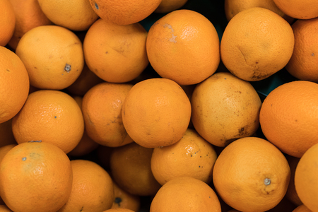 Fresh oranges on a local organic farm market on a tropical Bali island, Indonesia. Oranges background.の写真素材
