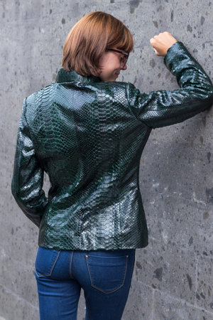 Portrait of beautiful sexy woman brunette hair wear fashion luxury snakeskin python coat, Bali...
