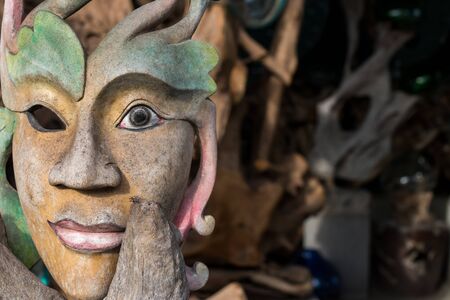 Face wood handmade.Sculpture on the tropical Bali island, Indonesia. Wood carving, art village.の写真素材