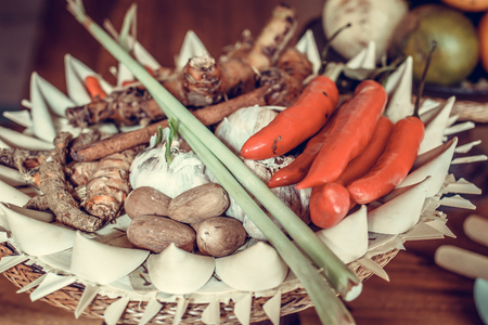 Red Chili peppers in a traditional balinese small basket. Bali island.の写真素材