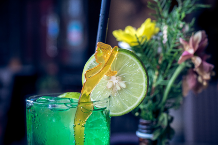 Glass of green refreshing lemonade with lime on top. Bali island.の写真素材