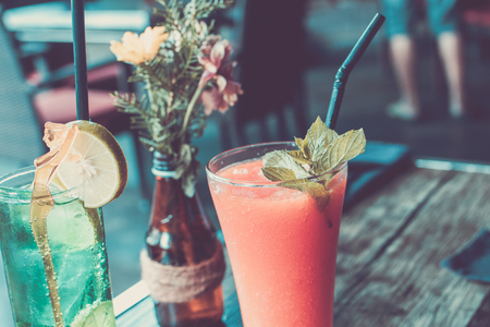 Healthy fruity papaya juice in a glass on a wooden table. Bali island.の写真素材