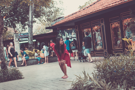 BALI, INDONESIA - JUNE 30, 2017: Young asian woman posing on the street of Bali collection, Bali island.のeditorial素材