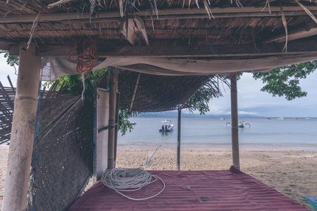 Lonely gazebo on the beach of tropical island Nusa Lembongan, Bali, Indonesia.の写真素材