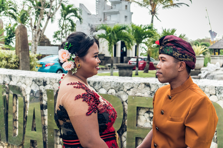 Lovely honeymoon balinese couple in traditional clothes together in nature. Bali island, Indonesia. Asia.の写真素材