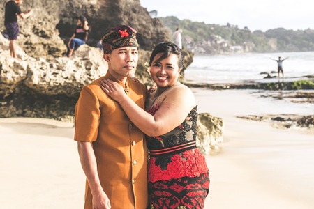 Lovely honeymoon balinese couple in traditional clothes together in nature. Bali island. Asia.の写真素材