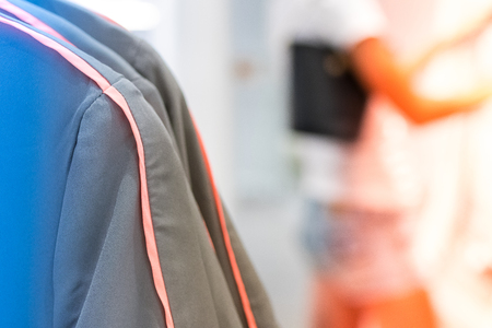 Close up of women clothes hanging in the store. Shopping mall. Fashion concept.の写真素材