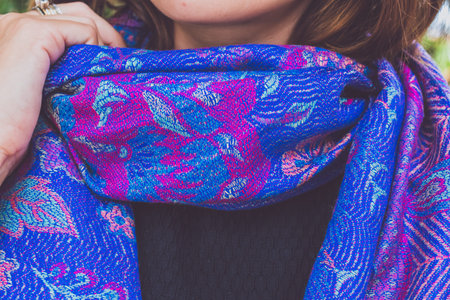 Yong woman hands with cashmere scarf. Bali island. Fashion shot.
