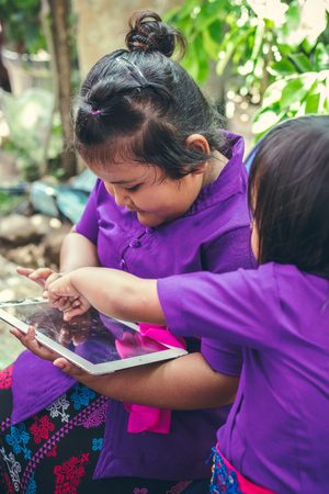 BALI, INDONESIA - OCTOBER 23, 2017: Balinese asian kids on a wedding ceremony. Bali island, Indonesia.のeditorial素材