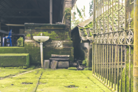 VIntage Rusty Fence in the balinese temple, tropical island of Bali, Indonesia. Hindu temple. Ancient fence. Asia.の写真素材