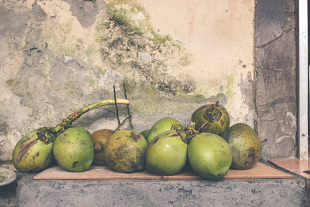 Fresh young coconuts. Tropical island of Bali, Indonesia. Exotic raw fruit.
