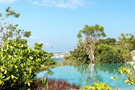 Infinity pool on the bright summer day. Bali island. Indonesia, Asia.の写真素材