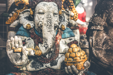 Hindu god lord Ganesha statue on the street in Ubud, Bali island.の写真素材