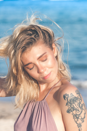 Sexy young woman posing on the tropical beach of Bali island, Indonesia. Asia.の写真素材